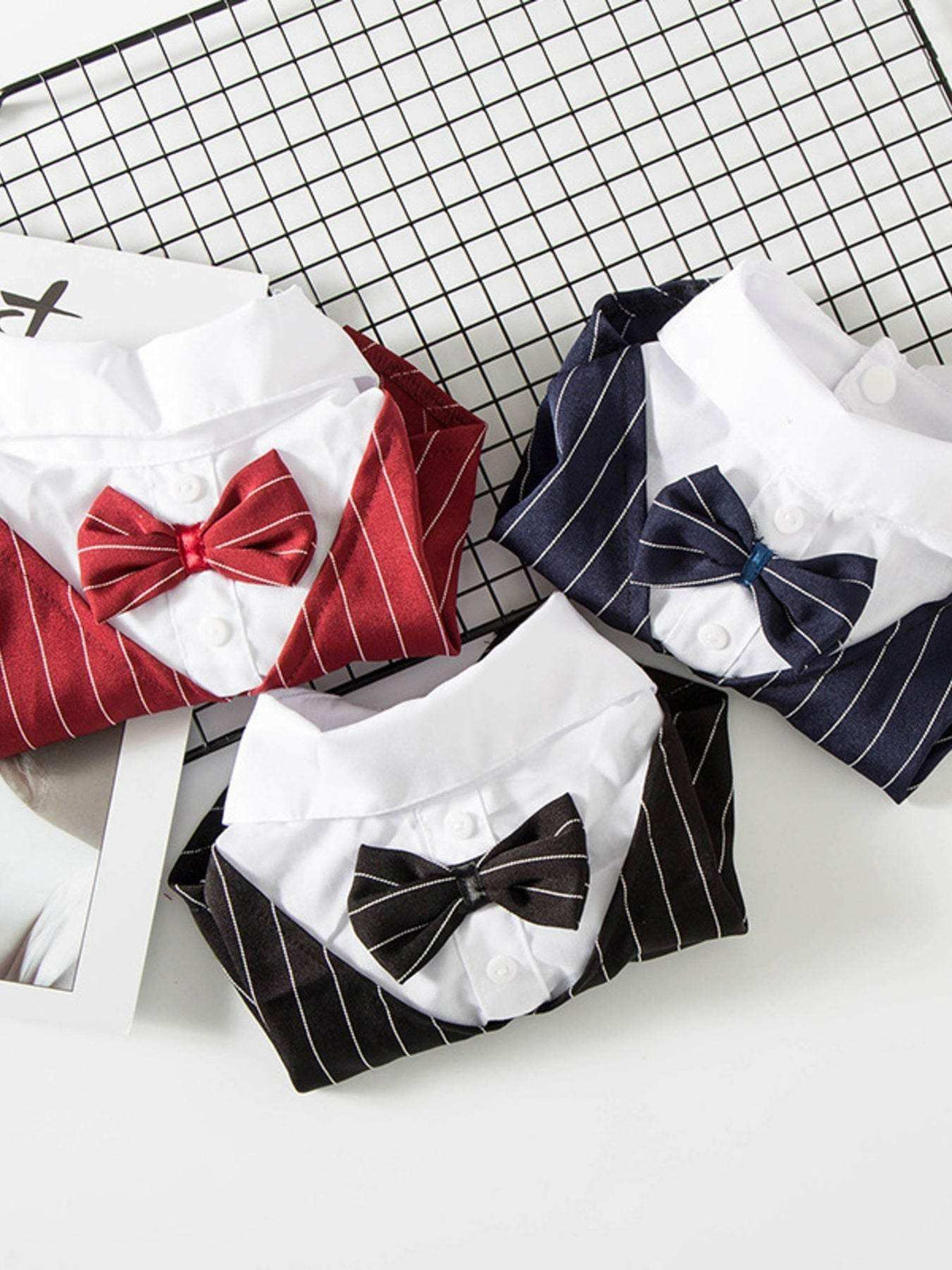 Small dog wearing striped bow tie blazer formal pet outfit