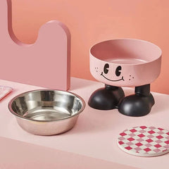 Stainless steel elevated dog bowl with non-slip base and smiling face design