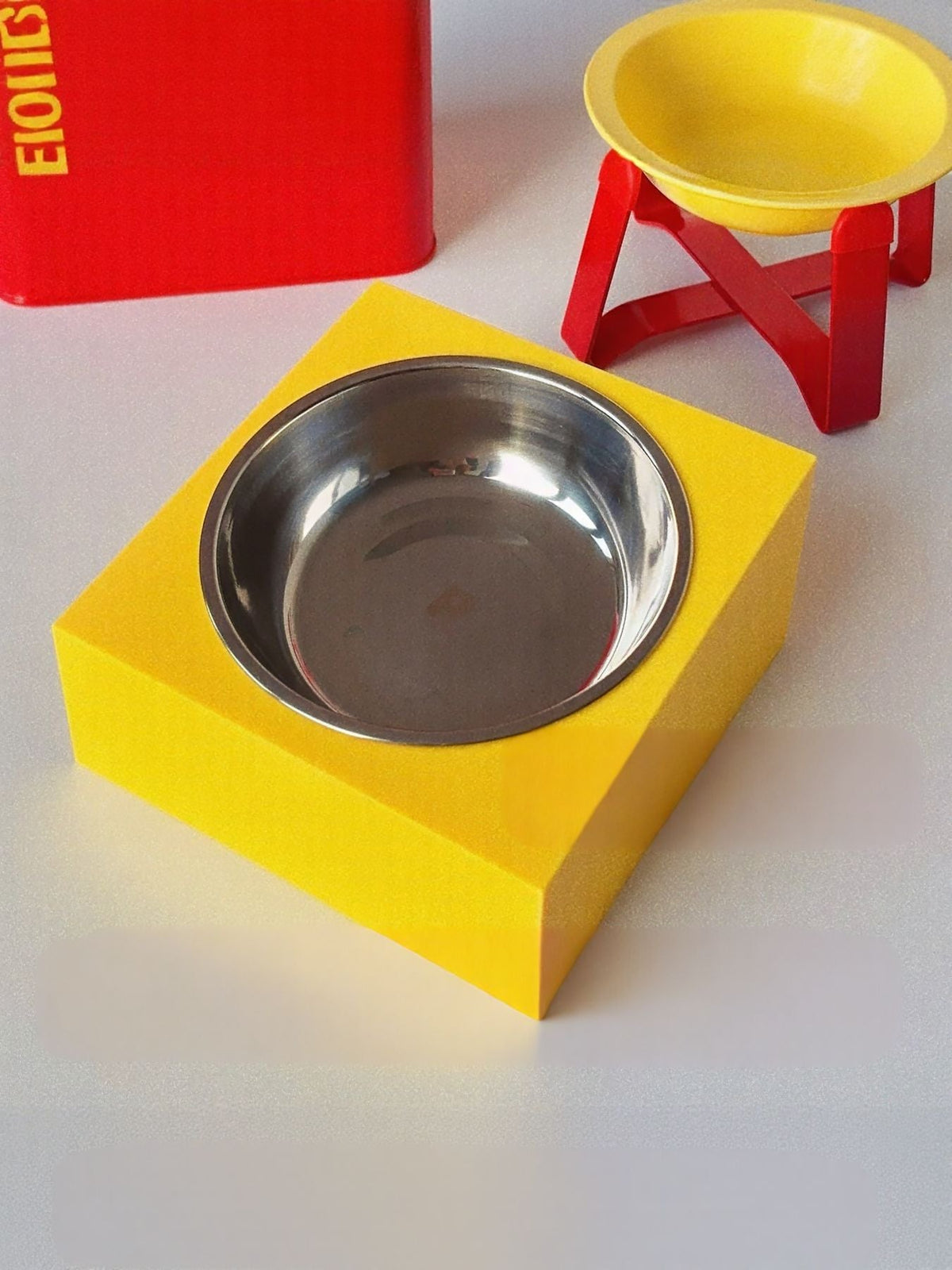 Red airtight pet food storage container with scoop for dogs and cats