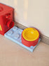 Red airtight pet food storage container with scoop and yellow logo