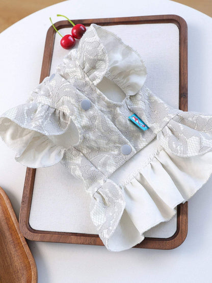 Pet wearing ruffled dress with bow for special occasions